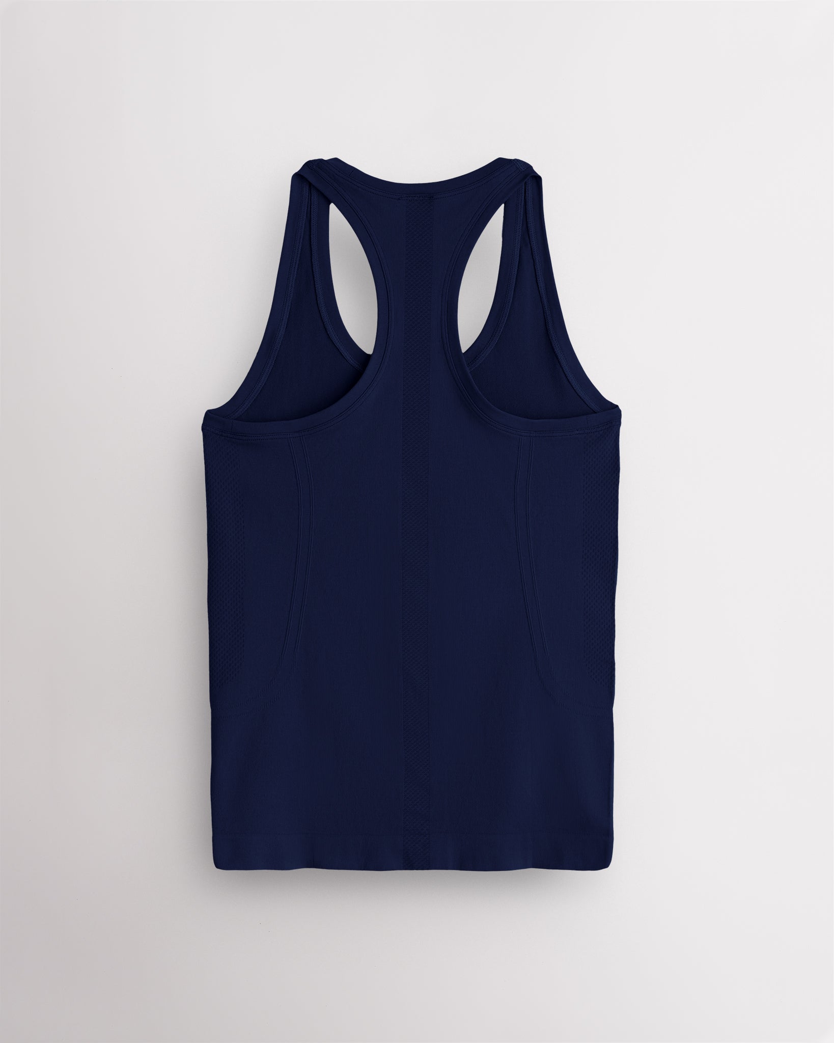 Back view of the navy Stelle seamless tank top, laid flat to show the racerback straps.