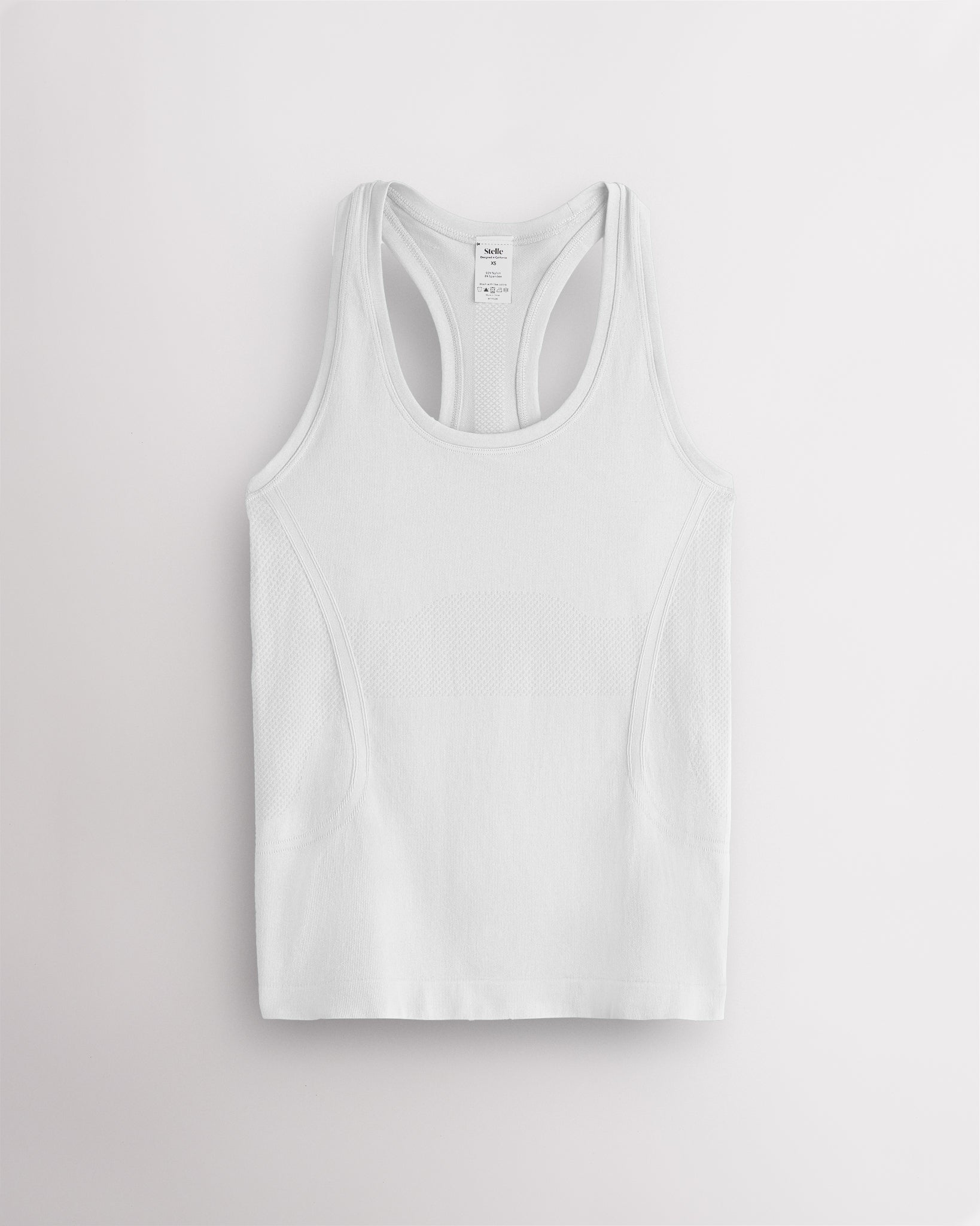White Stelle women's seamless racerback tank top with a round neckline.