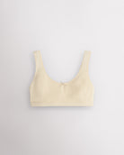 Stelle girls cotton bralette in soft butter with wide straps, soft lining, and small bow detail