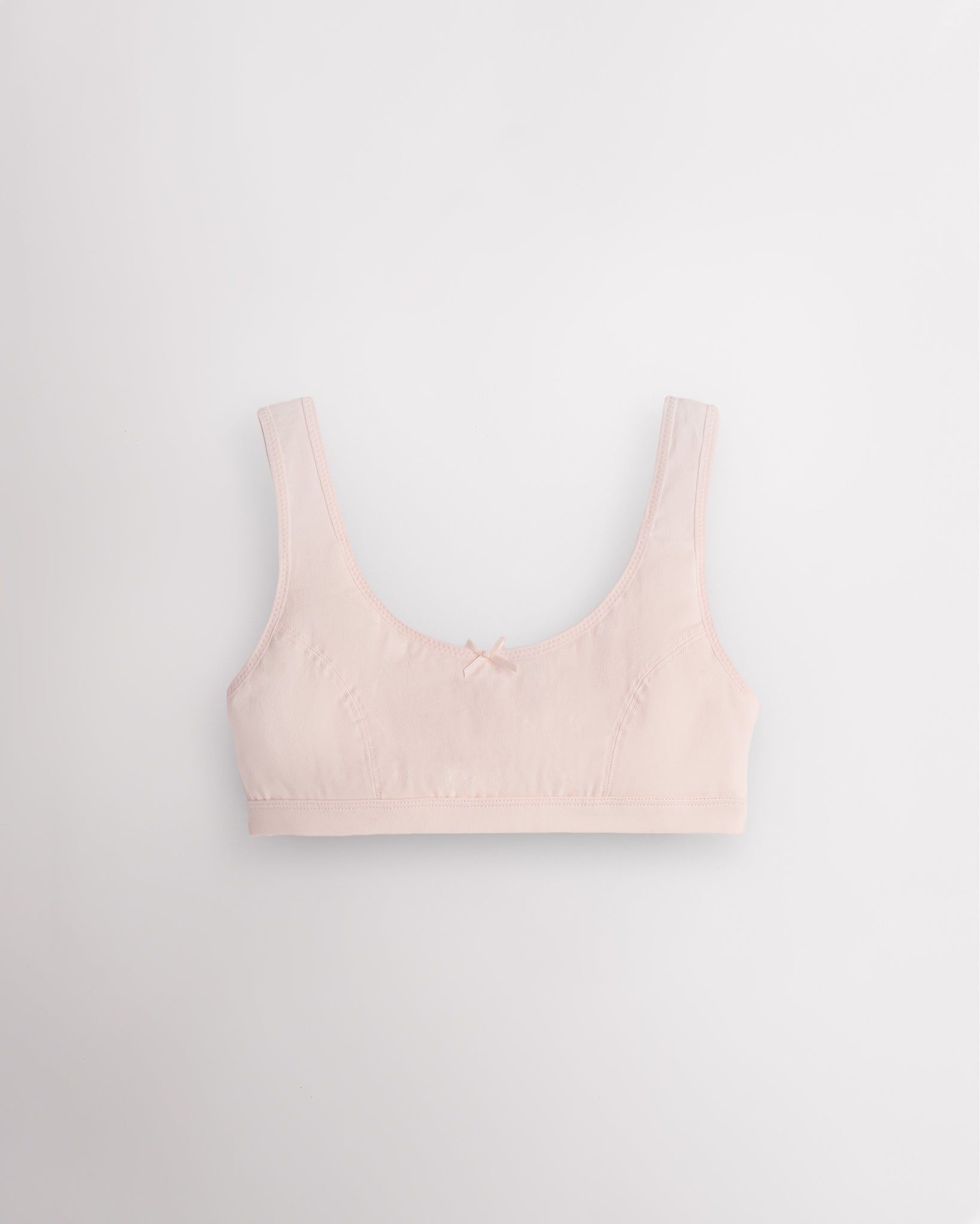 Stelle girls cotton bralette in whisper pink with wide straps, cotton padding, and easy layering design