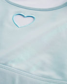 Close-up of Light Blue shimmer crop top showing heart cutout detail, smooth stitching, and iridescent fabric.