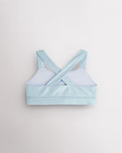 Back view of light blue metallic dance top with criss-cross racerback straps and a supportive band.