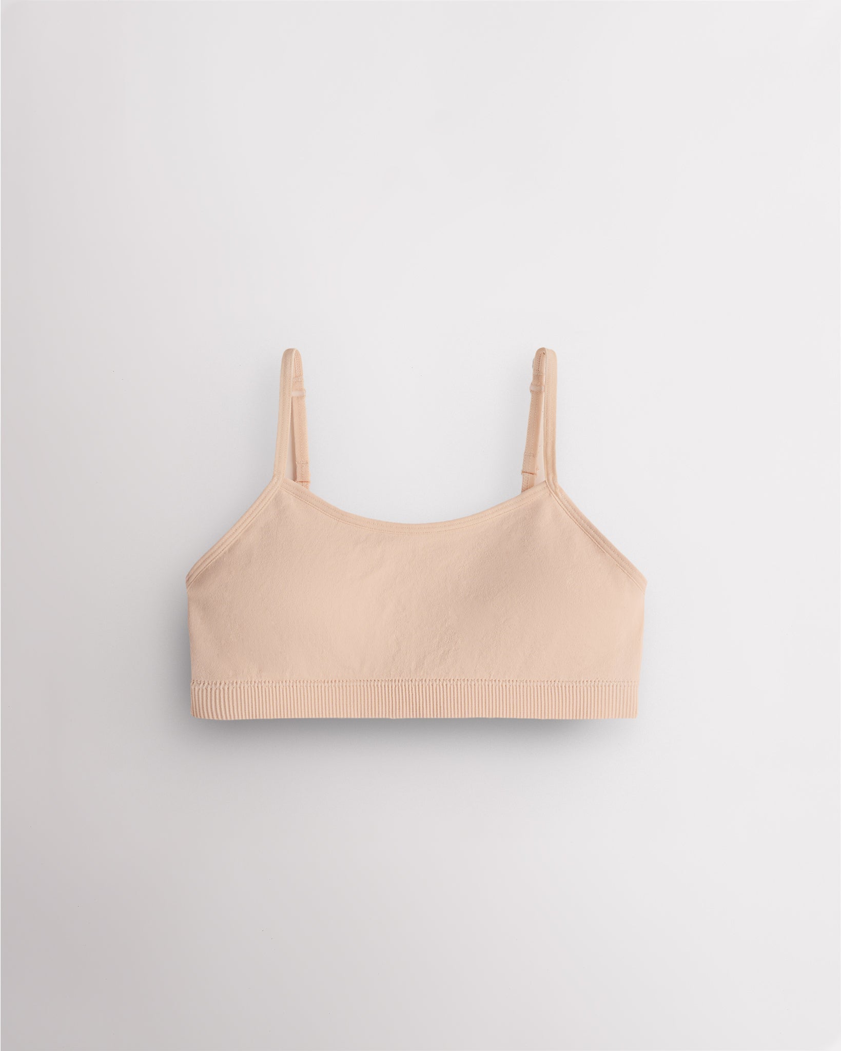 Soft Butter Stelle girls seamless cami bra with slim adjustable straps and soft ribbed support band.
