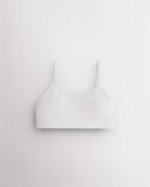 White Stelle girls seamless cami bra with slim adjustable straps and soft ribbed support band.