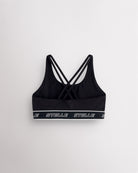 Back of the black Stelle girls sports bra laid flat, showing the criss-cross straps.