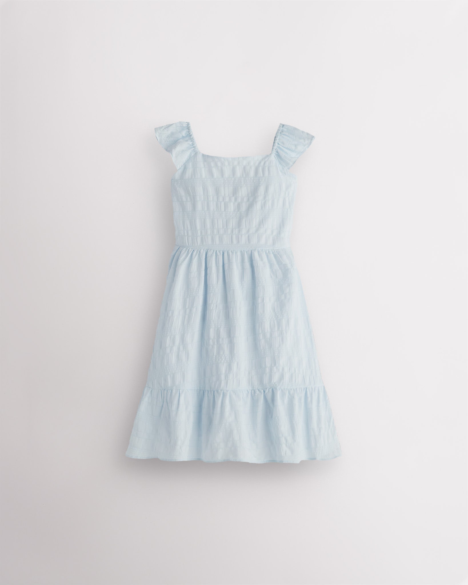 Girls light blue flutter sleeve sundress with square neckline, smocked waist, and tiered hem, lightweight summer dress front view