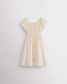 Back view of butter girls summer dress showing smocked back, short sleeves, and soft gathered skirt.