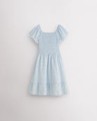 Back view of light blue girls summer dress showing smocked back, short sleeves, and soft gathered skirt.