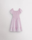 Back view of lilac girls summer dress showing smocked back, short sleeves, and soft gathered skirt.