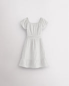 White girls smocked summer dress with short sleeves, square neck, fit-and-flare shape, and ruffle hem.