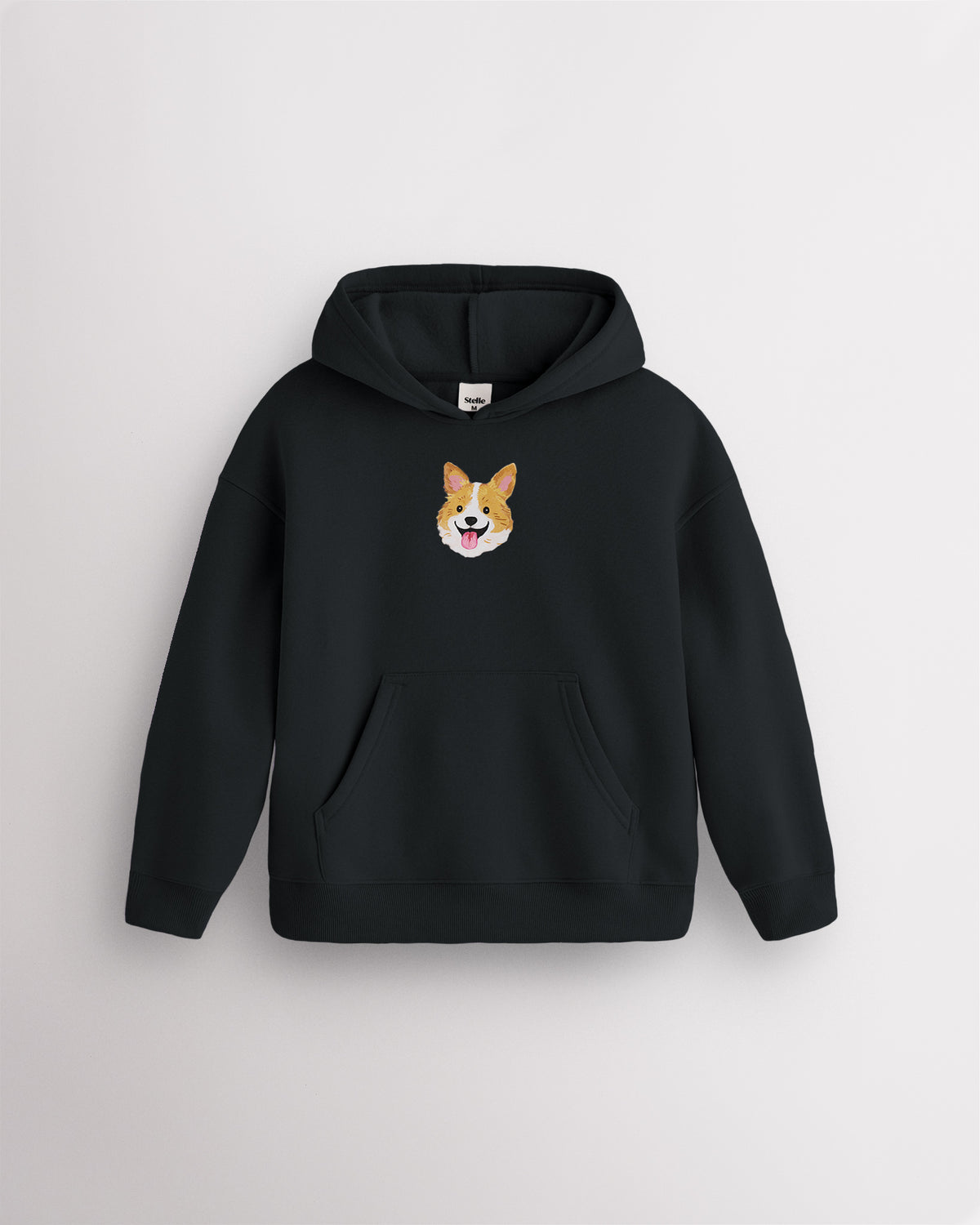 Black kids dog print hoodie laid flat with hood, front kangaroo pocket, ribbed cuffs and hem, and corgi graphic.
