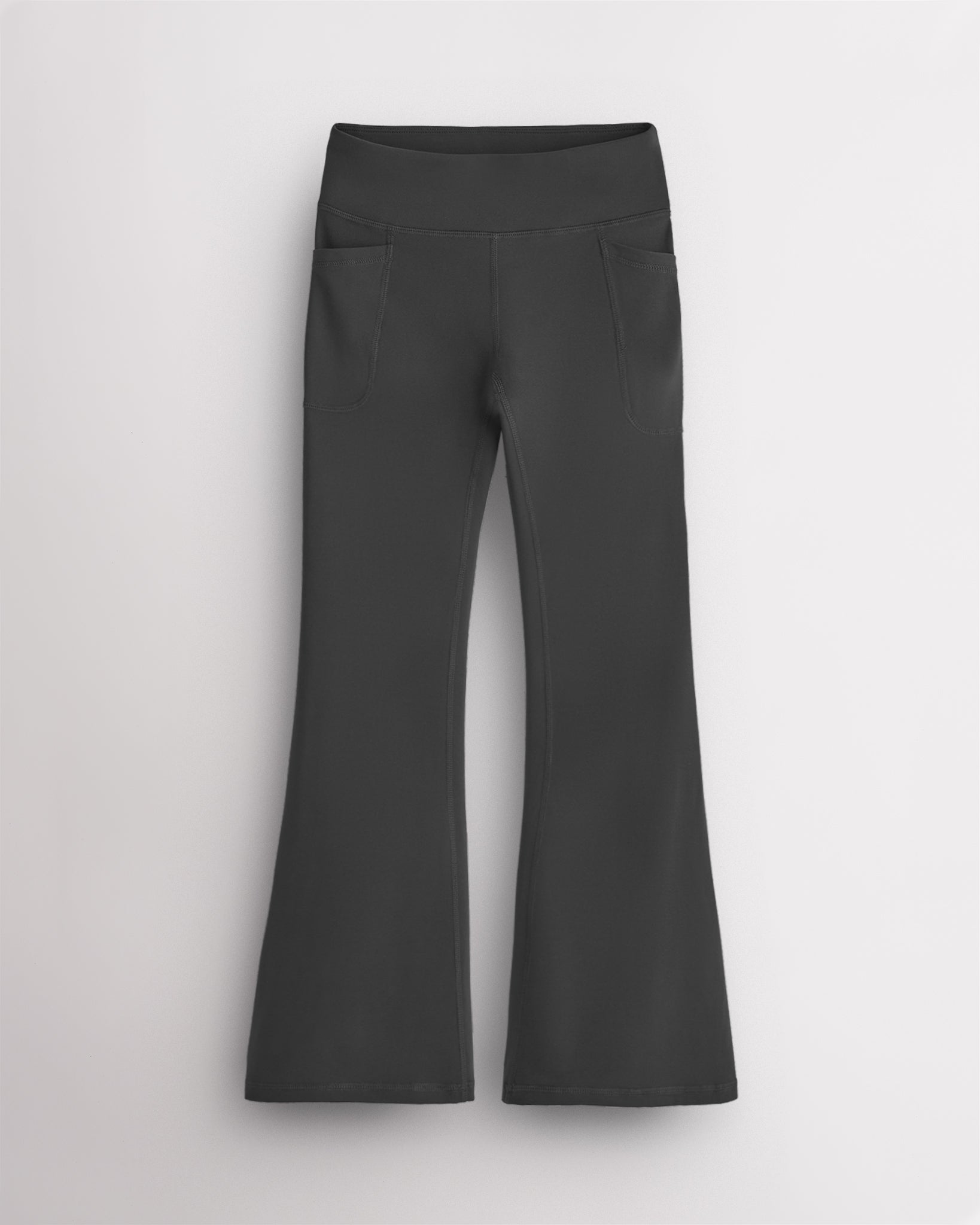 Charcoal girls flare leggings with a high-waisted fit, two deep side pockets, and extra flared legs for active and casual wear.