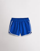 Girls royal blue athletic shorts with white trim, a stretchy elastic waistband, curved hems, and lightweight sporty design.