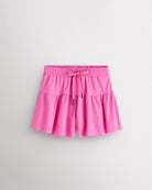 Cotton Candy Kids Let’s Bounce Shorts with flowy design, elastic waistband, drawstring, lightweight fabric, and built-in lining for practice and play.