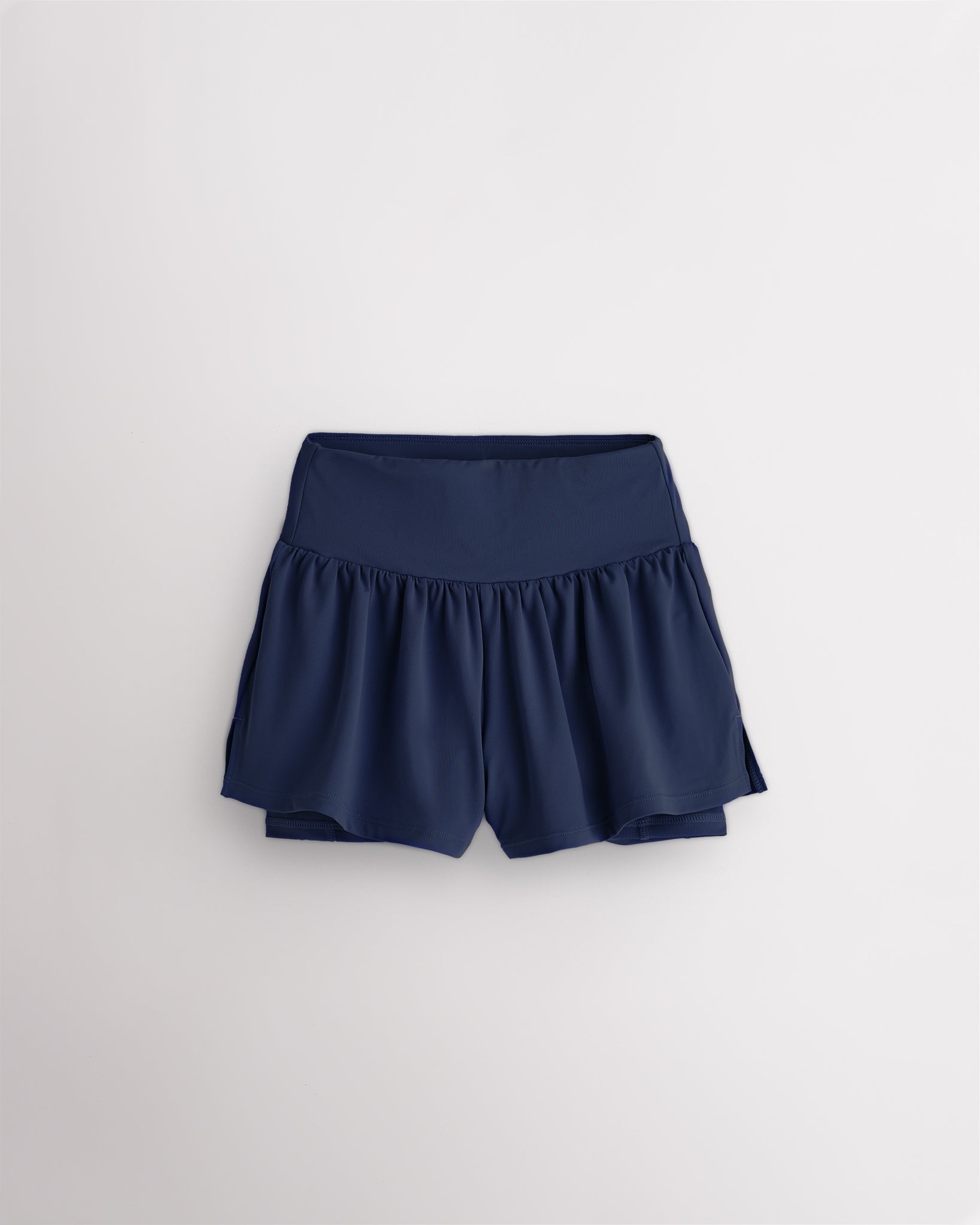 Navy girls 2-in-1 high waisted shorts with flowy outer layer and built-in liner for comfort and active movement