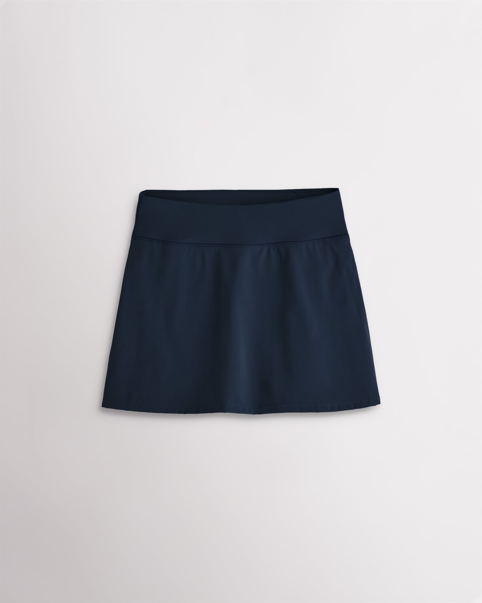 Navy girls ruffle tennis skirt with elastic waistband and smooth stretch fabric for active play
