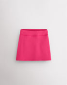 Dreamhouse pink girls ruffle tennis skirt with elastic waistband, built-in shorts, and smooth stretch fabric.