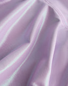 Close-up of lavender Stelle girls shimmer skort showing iridescent fabric texture and smooth seam detail