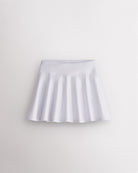 White Stelle girls shimmer skort with high-waisted fit and flared skirt design on white background