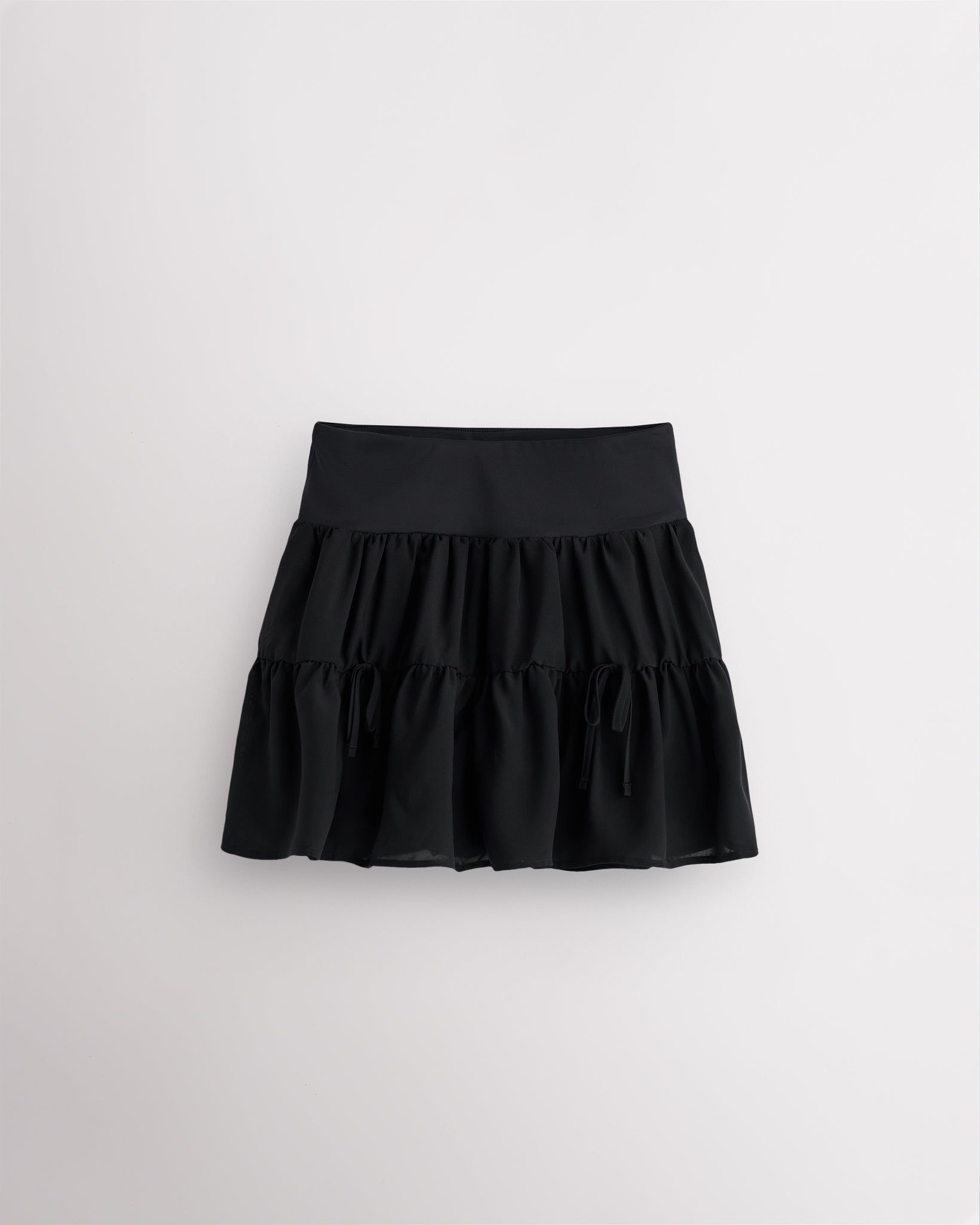 Black girls tennis skort with flowy layered chiffon design, high-rise waistband and built-in shorts