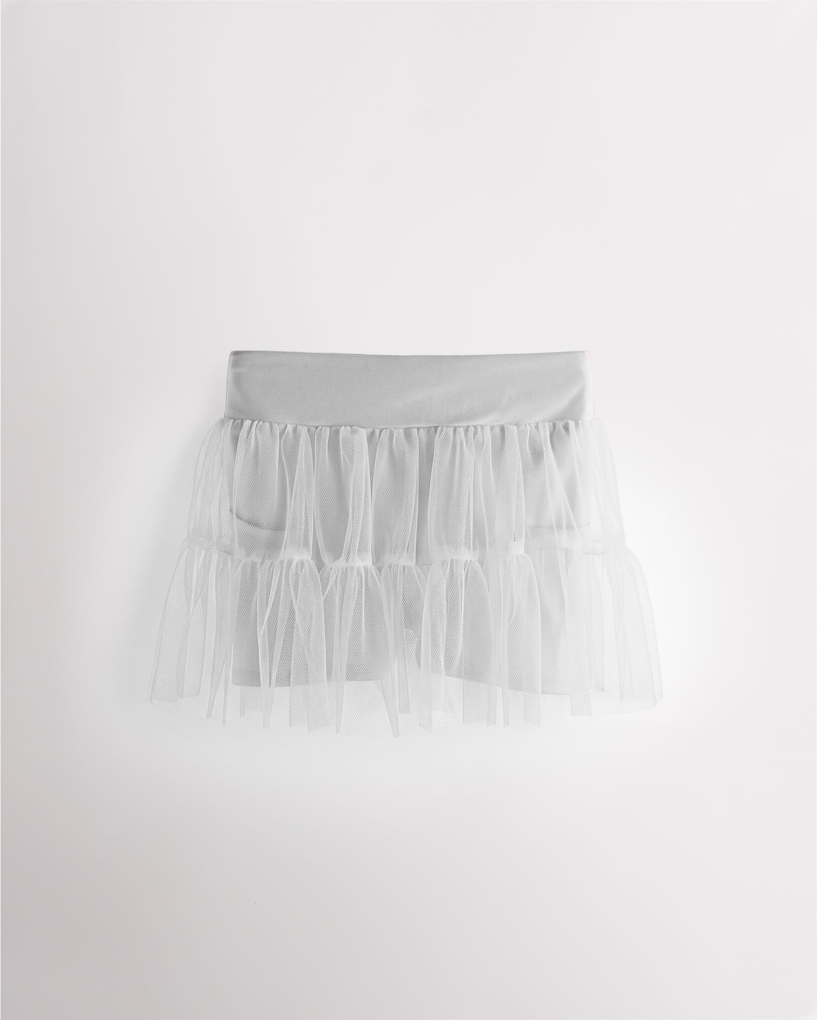 White girls layered skort with a high-waisted fit, tiered mesh skirt, and built-in shimmer shorts.