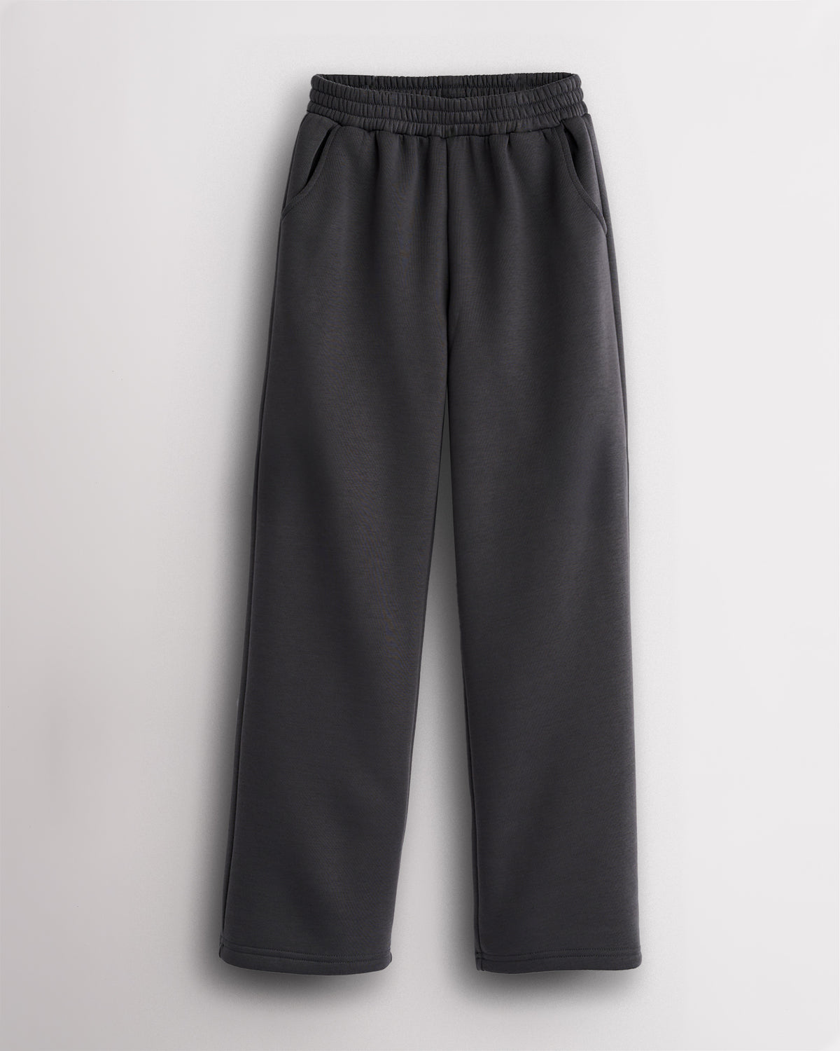 Charcoal kids fleece sweatpants with elastic waistband, roomy side pockets, straight-leg fit, and soft fleece lining for school, practice, and everyday wear.