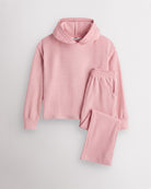 Dusty Rose Stelle kids waffle knit lounge set with a hooded top and matching pants, laid flat on a grey background.