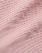 Close-up of the Dusty Rose waffle knit texture on the Stelle kids lounge set.