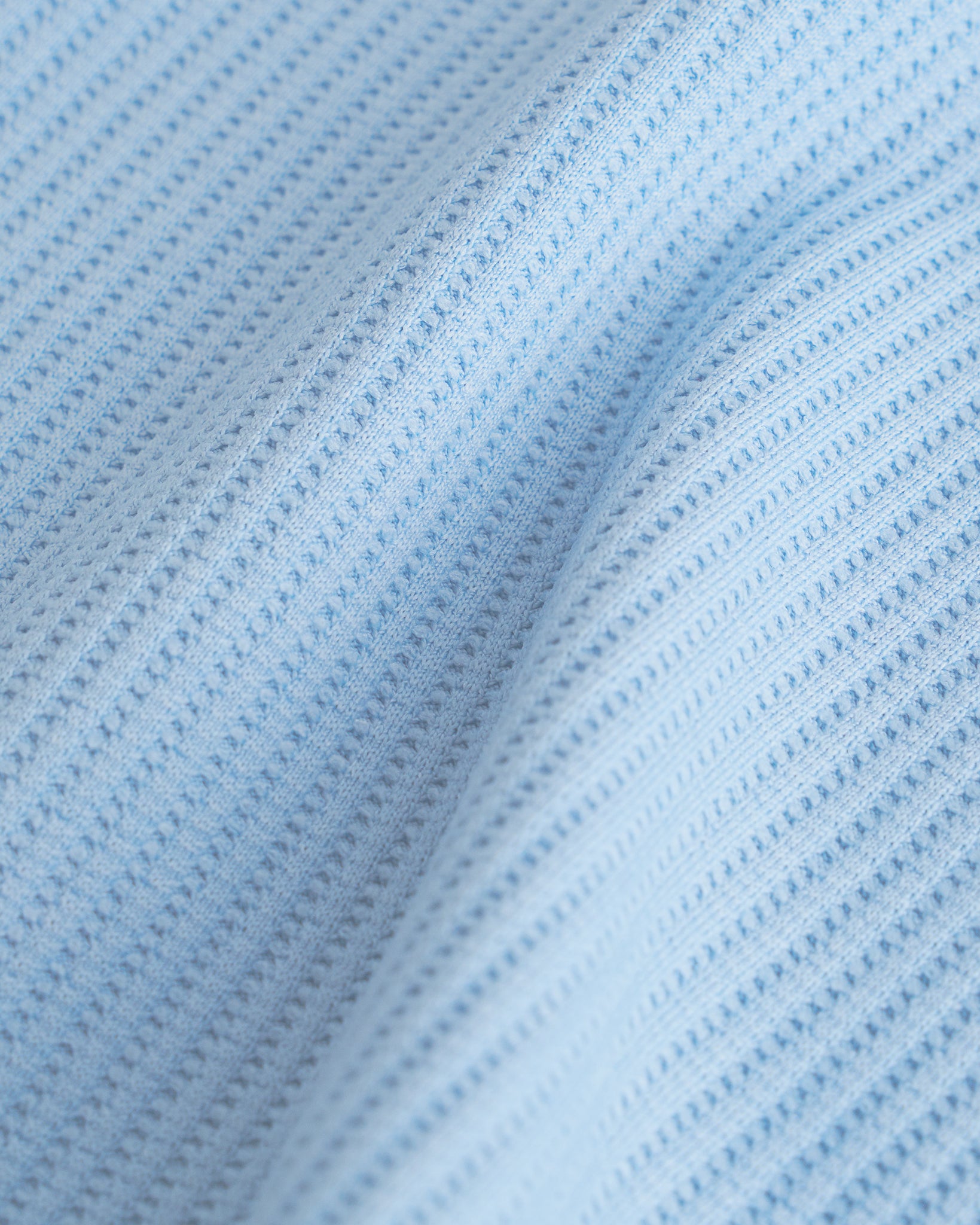 Close-up of the light blue waffle knit texture on the Stelle kids lounge set.