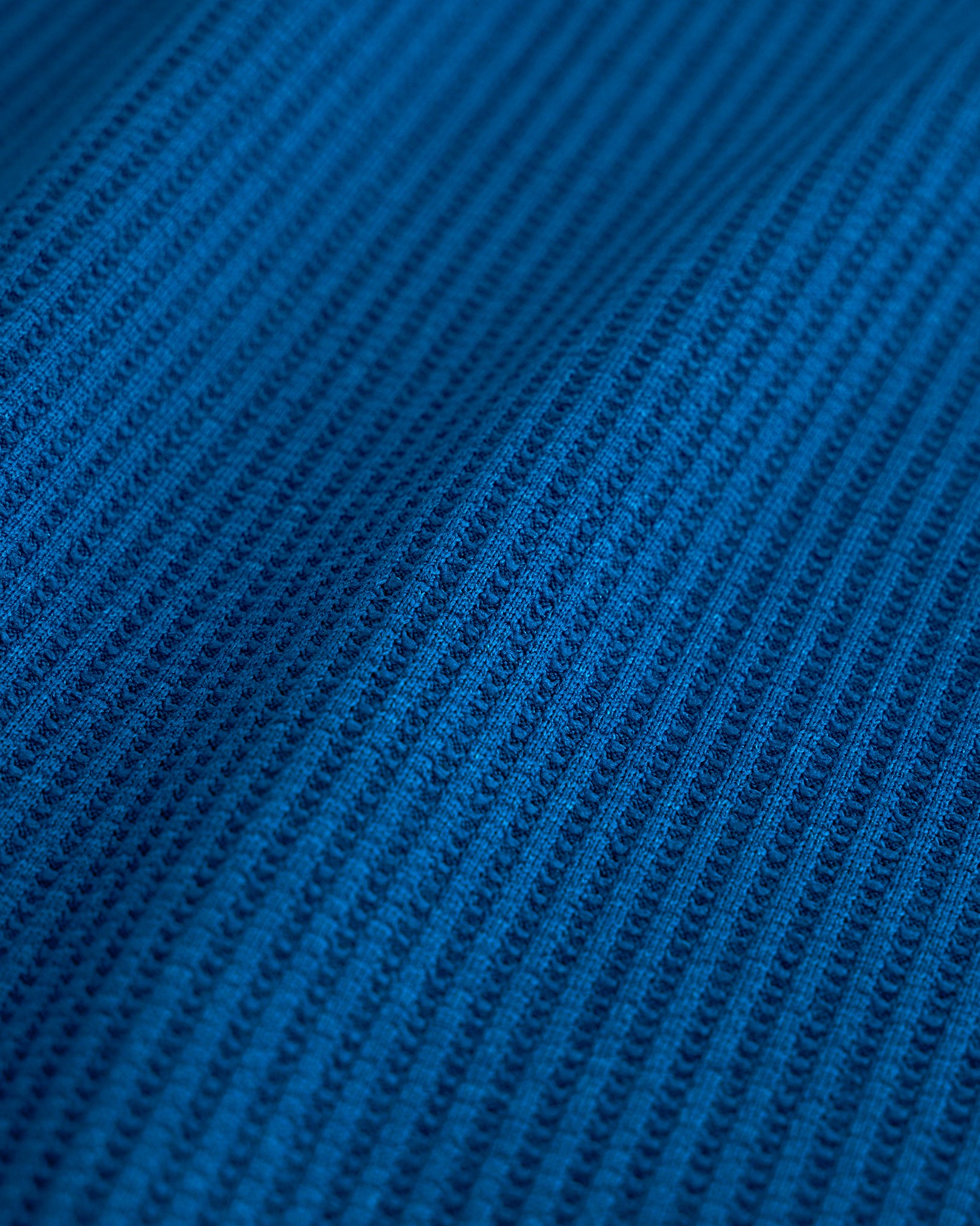 Close-up of the navy waffle knit texture on the Stelle kids lounge set.