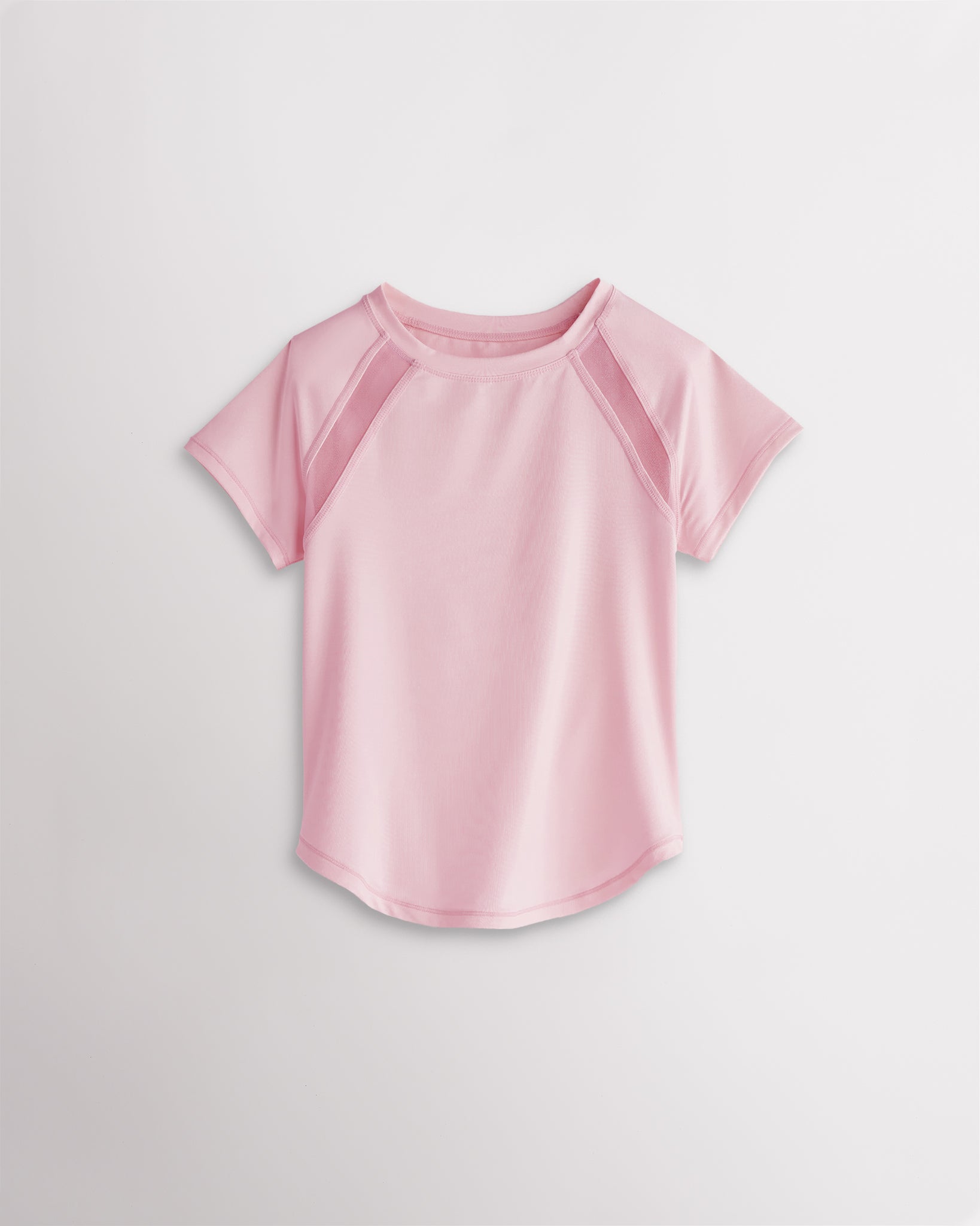 Kids light pink athletic t-shirt with mesh paneling and raglan sleeves, short sleeve breathable kids sports tee.