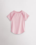 Kids light pink athletic t-shirt with mesh paneling and raglan sleeves, short sleeve breathable kids sports tee.