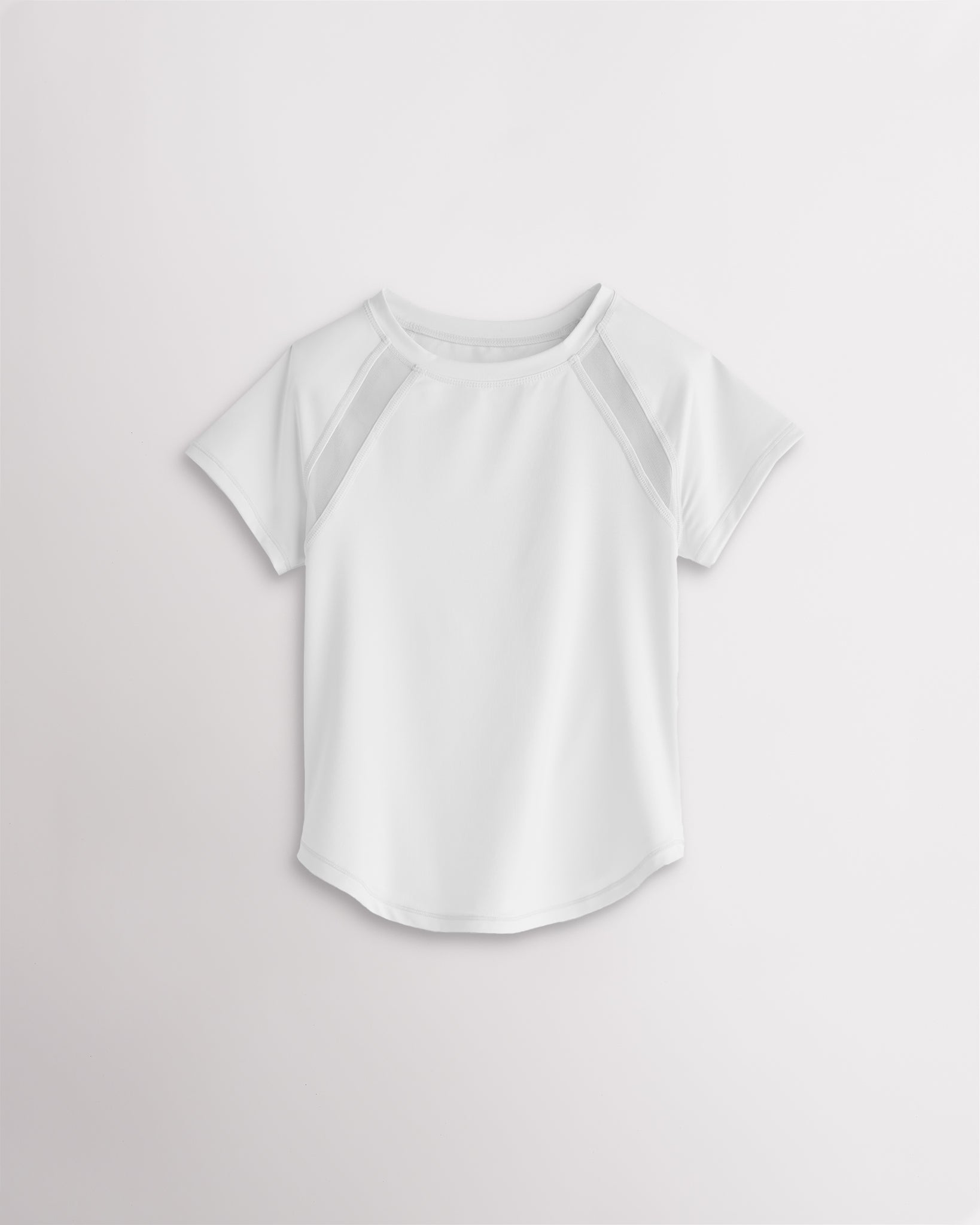 Kids white athletic t-shirt with mesh paneling and raglan sleeves, short sleeve breathable kids sports tee.