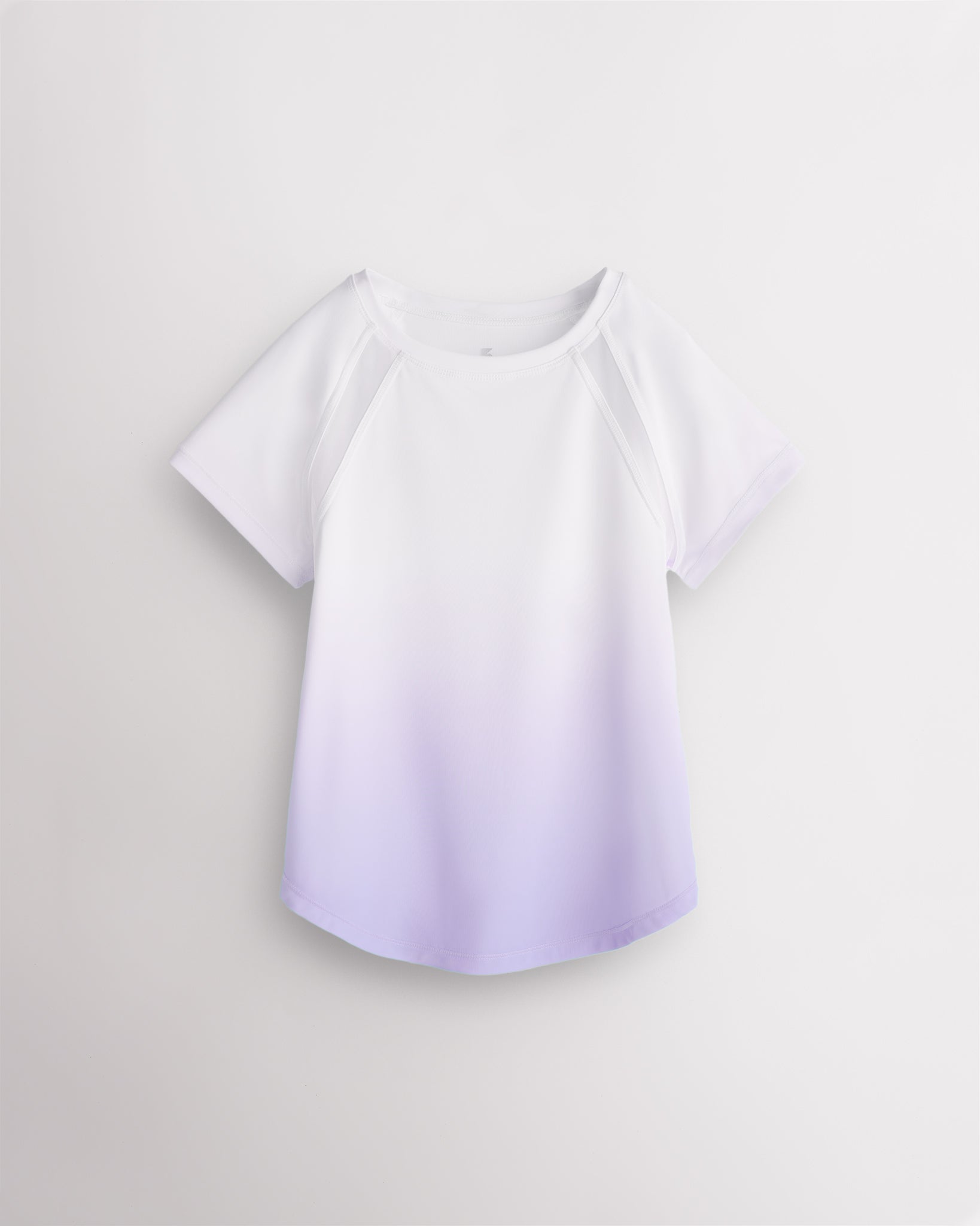 Stelle kids ombre athletic t-shirt with mesh paneling, raglan sleeves, and curved hem on white background