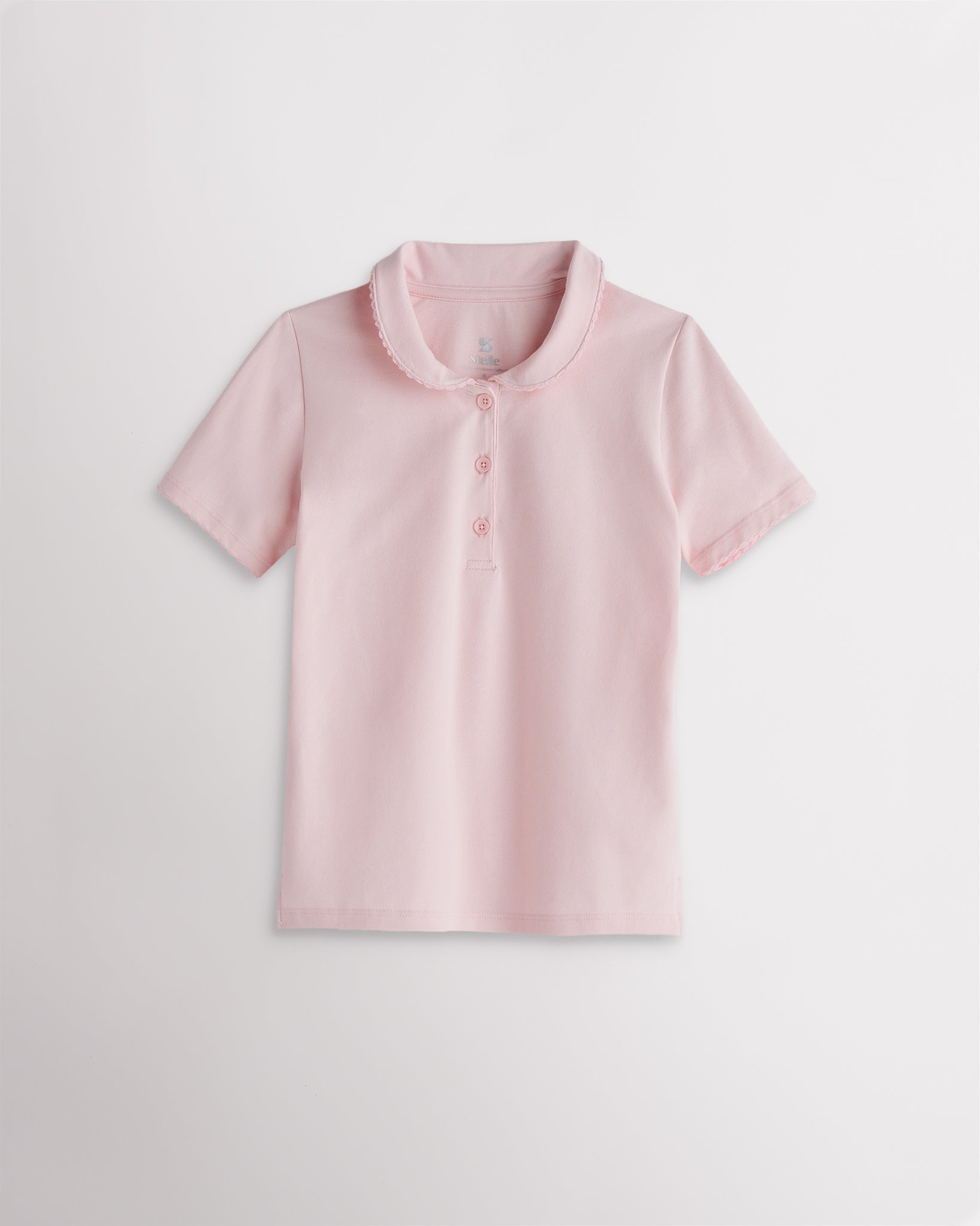 Girls light pink short sleeve pique polo shirt with a Peter Pan collar, scalloped trim, front button placket, and regular fit.