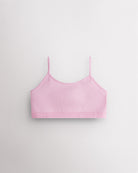 Petal pink Stelle girls seamless cami bra with thin adjustable straps, shown flat.
