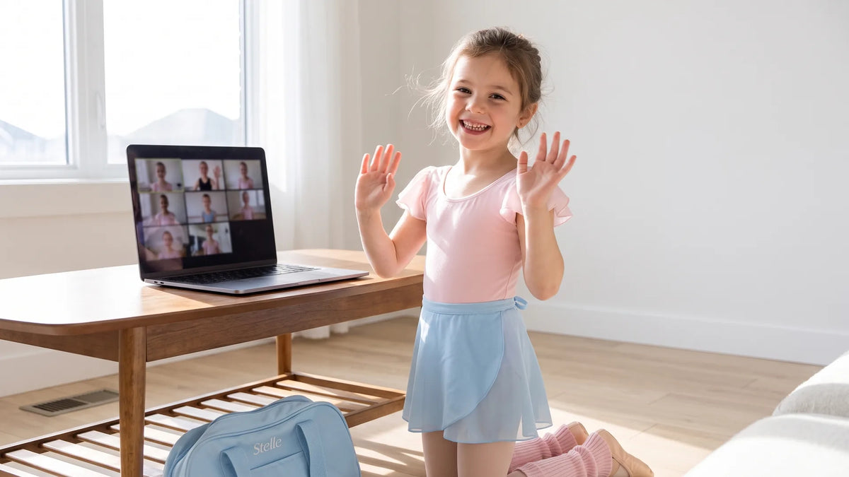 Young dancer waving at a live online dance class on a laptop
